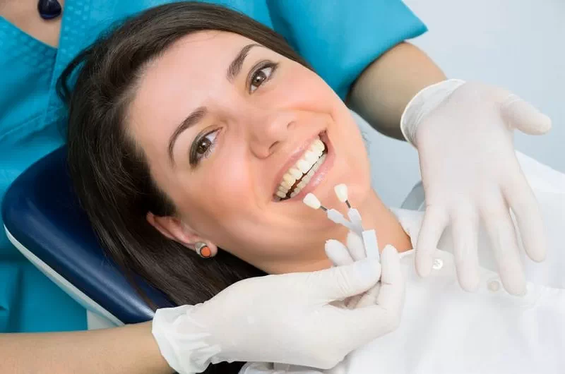 A smiling female patient at a dentist appointment